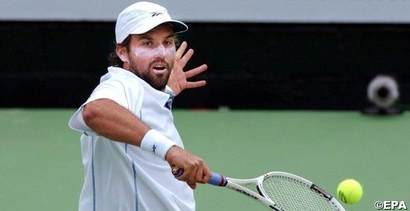 Pat Rafter in action during a doubles exhibition