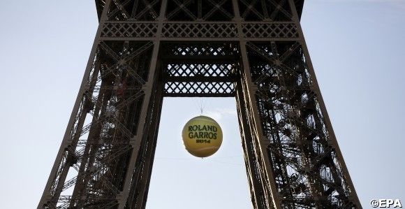 A giant tennis ball is placed inside the Eiffel tower in Paris