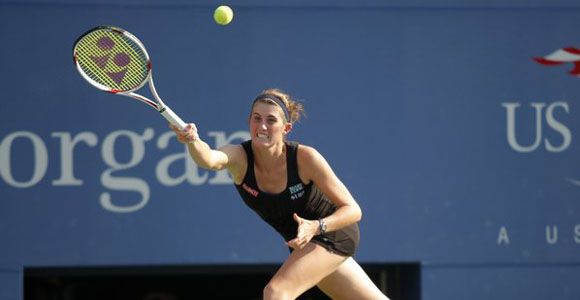 Rebecca Marino of Canada hits a return against Venus Williams of the U.S. at the U.S. Open tennis tournament in New York