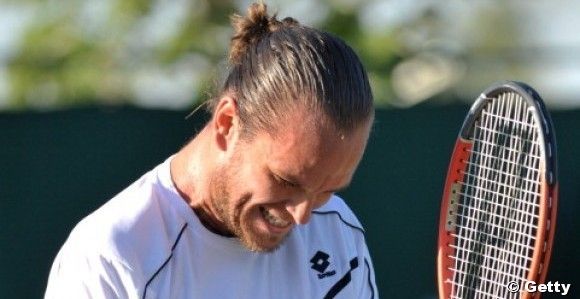 Belgian player Xavier Malisse reacts aft