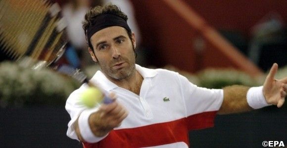 Spaniard tennis player Alex Corretja returns the ball
